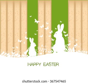 Easter greeting card with rabbit  on the wooden background