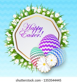 Easter greeting card template. Easter eggs on green grass with daisies. Bright sunny holiday card.