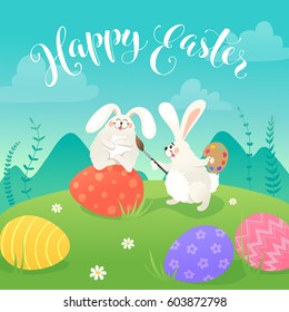 Easter greeting card with white cute bunnies drawing on colorful eggs. Fun illustration of rabbits and eggs on grass and Happy Easter text.
