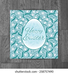Easter greeting card with white tulips on wooden background, old fashion, rustic or retro style