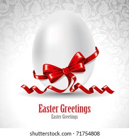 Easter greetings card with egg and red ribbon. Vector image.