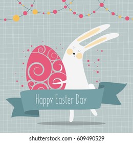 Easter greetings card.Easter bunny holding an egg
