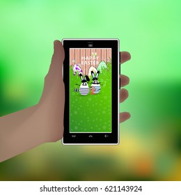 Easter. Hold in your hand a smart phone. Illustration for your design. Eared rabbit-egg white captain with ship's steering wheel and sailor