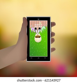 Easter. Hold in your hand a smart phone. Illustration for your design. Eared rabbit-egg with chocolate cupcake in hands