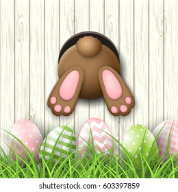 Easter motive, brown bunny bottom and easter pink and green eggs and fresh grass on white wooden background, vector illustration, eps 10 with transparency and gradient meshes