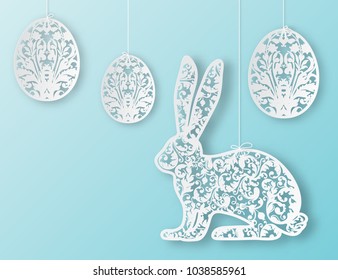 Easter paper art with eggs and cute ornate rabbit with floral motifs. Holiday origami concept. Paper carved hare. Holiday design