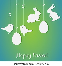 Easter paper decoration in the form of rabbits, birdsl, eggs. Holiday symbols on green background for invitations, posters and easter card