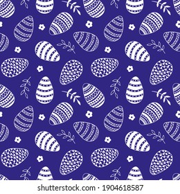 Easter pattern with decorated eggs, branches, leaves and flowers in doodle style on dark blue background. Scrapbook paper, wrapping paper, fabric, textile designs.