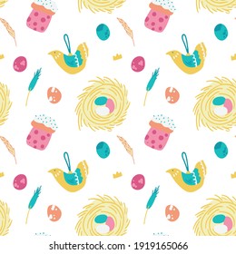Easter pattern with festive attributes in the form of a nest, cake, birds and eggs on a white background