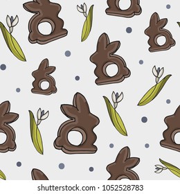 Easter Pattern with easter rabbit, snowdrops and dots.   Isolated Seamless spring background. Vector illustration.