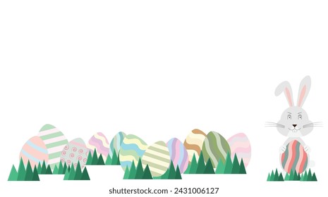 Easter Rabbit with colorful easter eggs on grass
