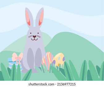 easter rabbit and eggs in the grass