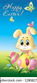 Easter Rabbit with eggs  in the grass on blue sky background