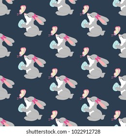 Easter rabbit seamless pattern on the blue background. Vector illustration