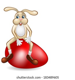 Easter rabbit sitting over gigantic red egg