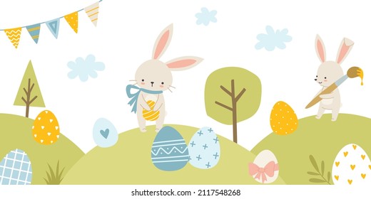 Easter rabbits on the lawn with painted eggs. Cute bunny on meadow eggs hunt.