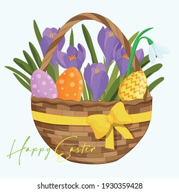 Easter. Round wicker basket with spring flowers and Easter eggs