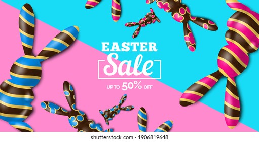 easter sale banner with 3d chocolate decorated rabbits on cyan pink  background