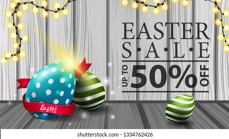 Easter sale, modern horizontal discount banner with wood texture, garland and Easter eggs