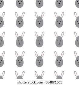 Easter seamless background with repeating bunny head in the shape of egg. For wallpaper, wrapping paper, textile decoration, invitations, greeting cards, postcards