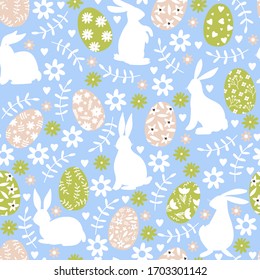 Easter seamless pattern with various silhouette bunnies, eggs, flowers and leaves. Texture for textile, postcard, wrapping paper, packaging etc. Vector illustration on blue background.