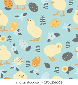 Easter seamless pattern with yellow chicks, orange eggs and flowers. Vector illustration. Blue farm, agriculture background.