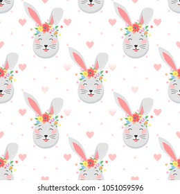 Easter seamless pattern.Cute funny bunny with dots and hearts.Easter holiday decorative background perfect for prints,flyers,banners,holiday invitations and more.