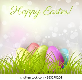 Easter shiny background with colorful eggs in grass