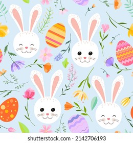 Easter spring seamless pattern. Bright colorful Easter eggs, spring flowers and herbs and cute Easter bunnies on a light blue background.