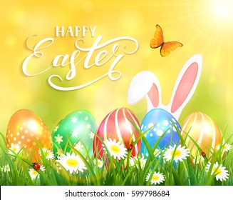 Easter theme with ears of bunny and butterflies flying above the colorful eggs in grass and flowers, yellow nature background with sun beams and lettering Happy Easter, illustration.