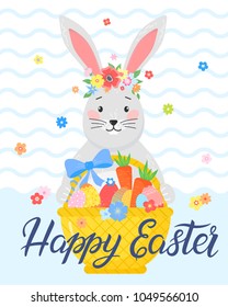 Easter typography.Hand drawn lettering,cute funny bunny and Easter basket with eggs,carrots and bow. Seasons greetings card perfect for prints, flyers,banners,holiday invitations and more.