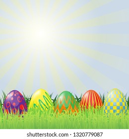 Easter vector theme. Colorful eggs lie in the green grass. The rays from the spring sun.