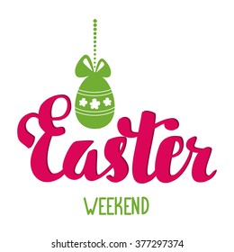 Easter weekend. Easter hand lettering. Easter egg with bow hanging on a string of beads.