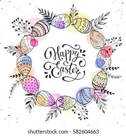 Easter wreath with easter eggs hand drawn black on white background. Decorative doodle frame from Easter eggs and floral elements. Easter eggs with ornaments in circle shape with watercolor dots.