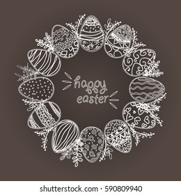 Easter wreath with easter eggs hand drawn on chalk board. Decorative doodle frame from Easter eggs and floral elements. Easter eggs with ornaments in circle shape.