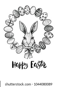 Easter wreath with eggs and head of a hare with bow. Happy Easter modern calligraphy. Black and white drawing illustration.