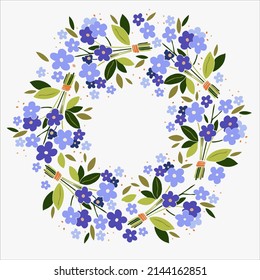 Easter wreath of forget me not flowers and leaves in a rustic style card