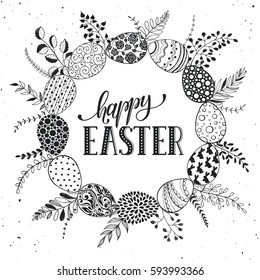 Easter wreath with hand drawn eggs and floral elements isolated on white background. Decorative frame from easter eggs with ornaments  in circle shape.