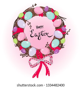Easter wreath of twigs with eggs and ribbons.
