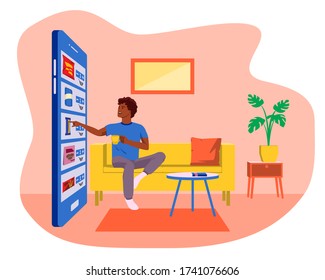 Easy online shopping with smartphone. Ecommerce concept. Young african american man sitting on sofa  and drinking coffee while doing online shopping with mobile phone. Stay home concept.