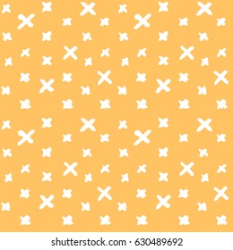 easy painted pattern of graphic white large and small crosses with textures on orange background