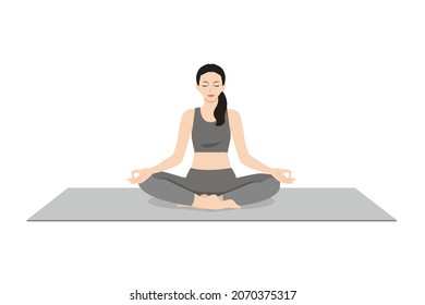 Easy Pose, Beautiful girl practice Sukhasana. Young attractive woman practicing yoga exercise. working out, black wearing sportswear, grey pants and top, indoor full length, calmness and relax.