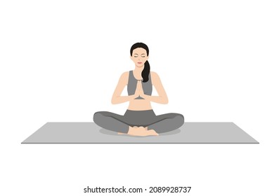 Easy Pose Prayer Hands, Beautiful girl practice Sukhasana Namaste Hands. Young attractive woman practicing yoga exercise. working out, black wearing sportswear, grey pants and top, calmness and relax