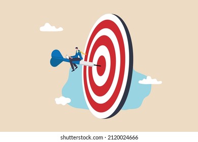 Easy win with good strategy and planning, reach goal and achieve target, perfection or victory concept, skillful businessman working on winning dart that hit on bullseye target.