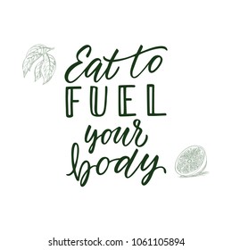 Eat to fuel your body! Calligraphic quote and veggi/fruit on background.