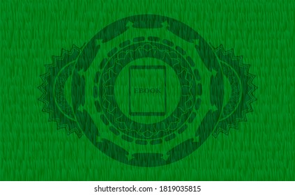 Ebook icon inside green grama grass emblem.   Eco exquisite background. Artistic illustration. 