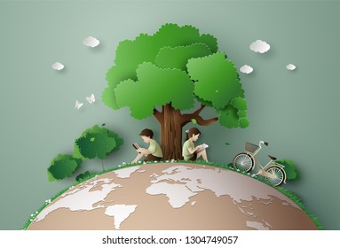 El concepto ecológico y ambiental con los niños lee un libro bajo el árbol grande, Papel arte 3d del estilo artesanal digital.