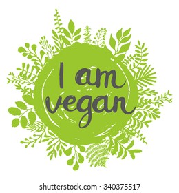 Eco friendly conceptual handwritten phrase I am vegan on green grunge stain with floral around it. For banners, posters, t-shirts, cards, stickers, advertisement. Brush typography. Vector 