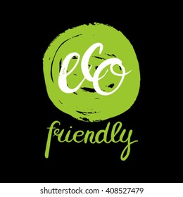 Eco friendly conceptual handwritten phrase ECO friendly on green grunge stain. For banners, posters, t-shirts, cards, stickers, advertisement. Hand lettered calligraphic design.