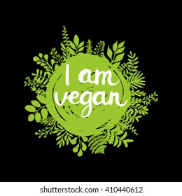 Eco friendly conceptual handwritten phrase I am vegan on green grunge stain with florals around it. For banners, posters, t-shirts, cards, stickers, advertisement. Vector